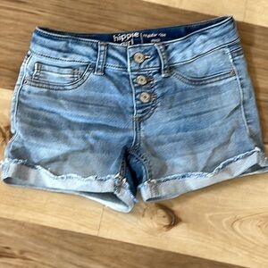 Cute stretchy denim shorts. Buttons up the front and feasted cuffed hem